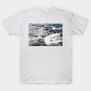 Seagulls flying over the crashing waves, Seahouses, Northumberland, UK T-Shirt